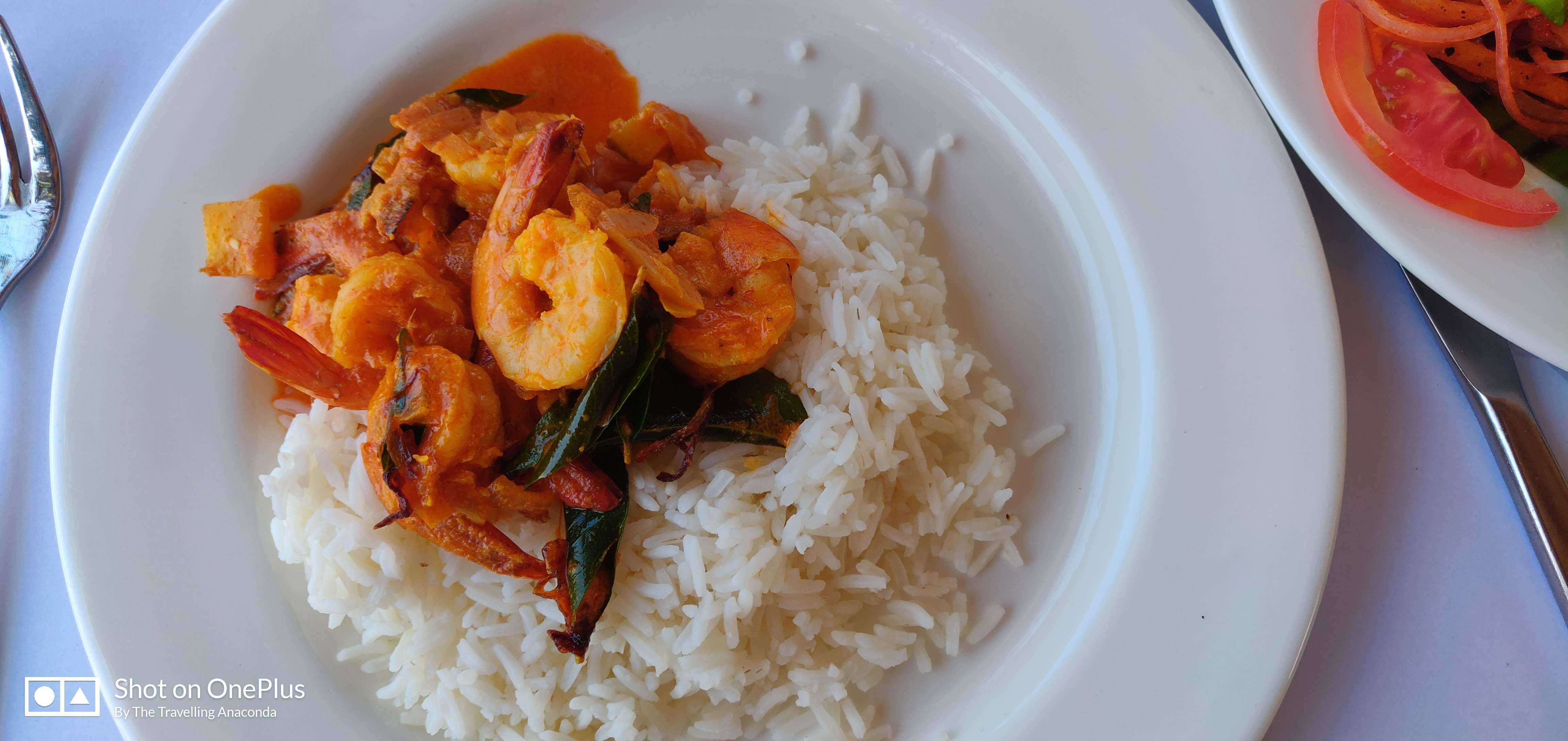 Eat a delicious plate of Prawn mango curry at Fort Kochi